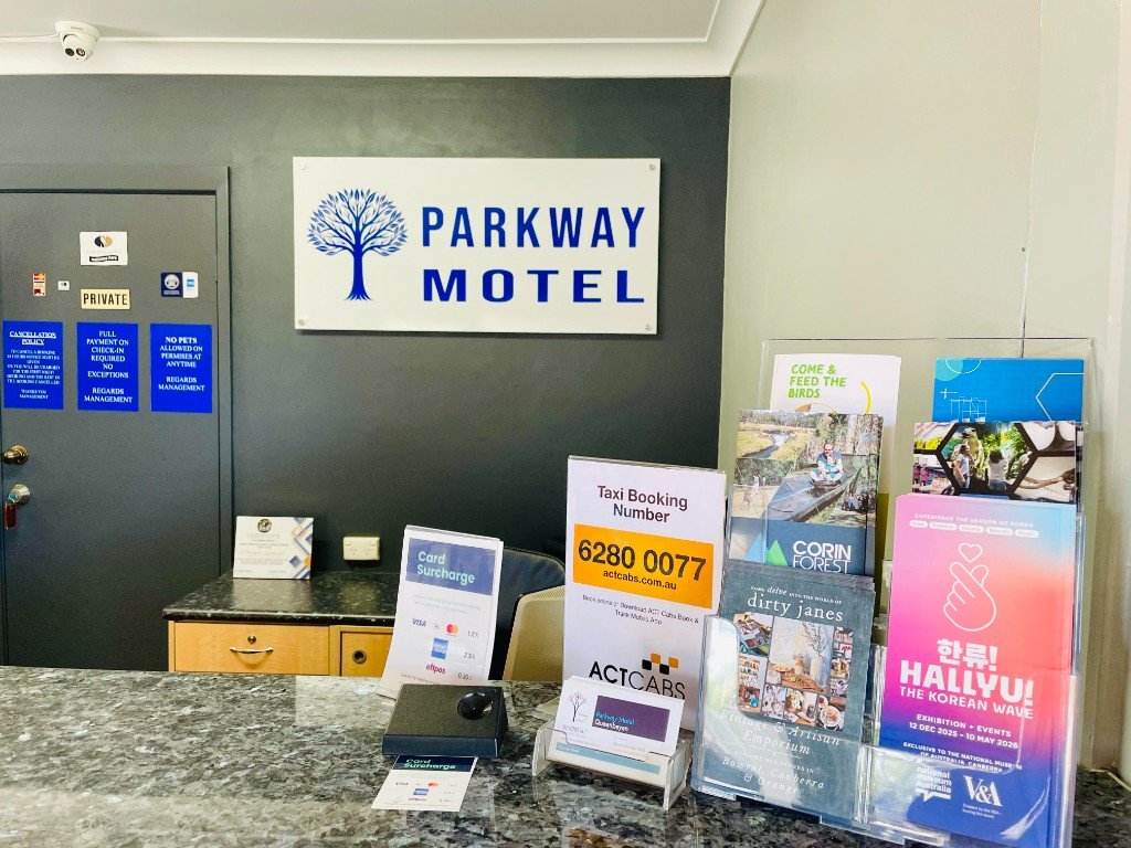 Parkway Motel reception desk with Parkway Motel signage, Queanbeyan ACT